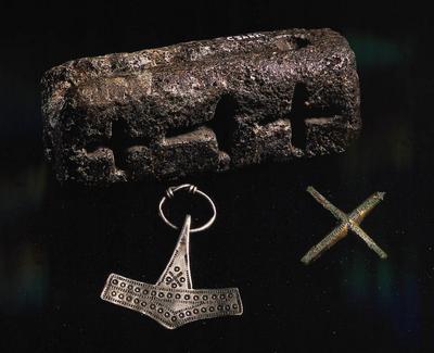 The Vikings could believe in several gods at the same time. Here is a casting mould with spaces for a Thor's hammer and two crosses. Christianity comes to Denmark